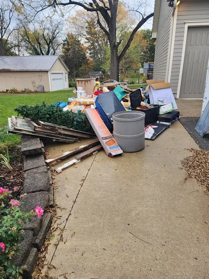 Dumpster being loaded with debris for Estate Cleanout Dumpster Rental in Golden